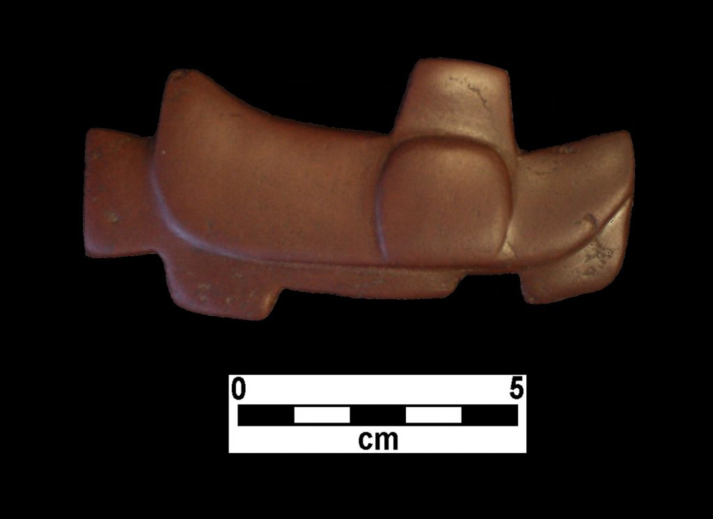 Middle Archaic (6000-4000 BC) stone effigy bead from Mississippi
